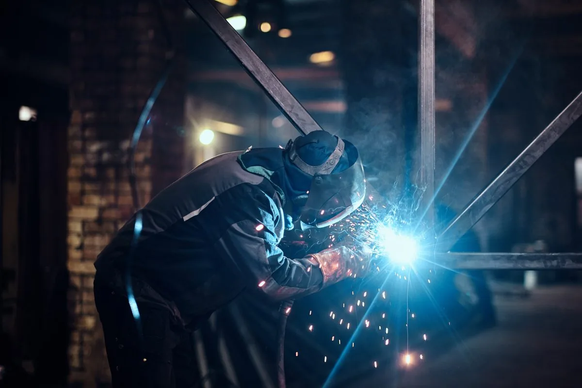 Certified specialist performing welding works